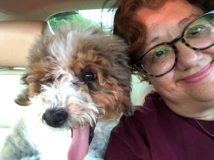 River the puppy and Diana Haneski, a library media specialist at Marjory Stoneman Douglas High School. Haneski helped shelter kids during the deadly shooting at the school on Valentine's Day. Now she will be bringing River into the school to help those coping with trauma.