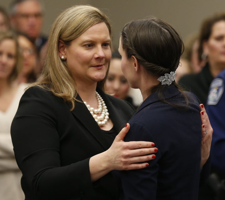 Michigan Assistant Attorney General Angela Povilaitis (L) hugs Rachael Denhollander during Larry Nassar's sentencing phase in Ingham County Circuit Court on Jan. 24, 2018 in Lansing, Michigan.