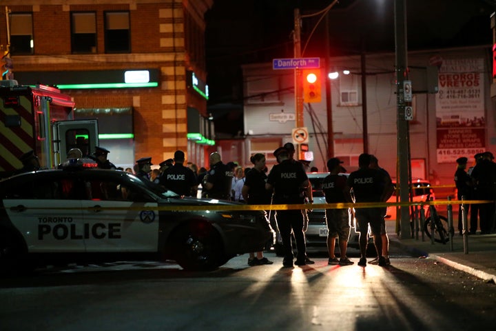 Police are seen near the scene of a mass shooting in Toronto, Canada, on Sunday.