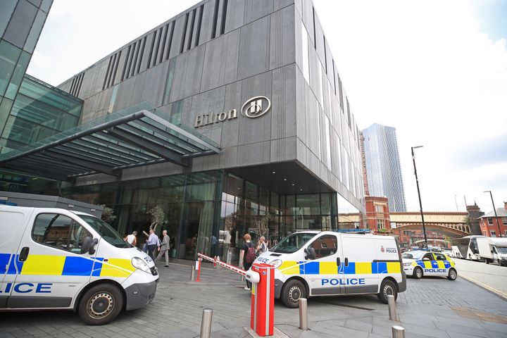 Police at the scene at the Hilton Hotel, Deansgate, Manchester where a woman with serious injuries to her neck was found this morning.
