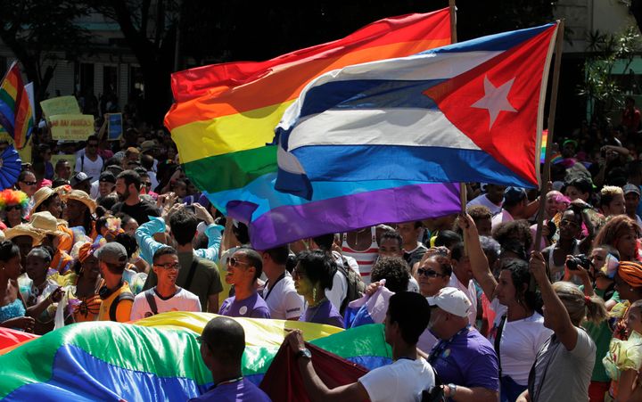 People take part in a gay pride parade in Havana, Cuba, on May 10, 2014. 