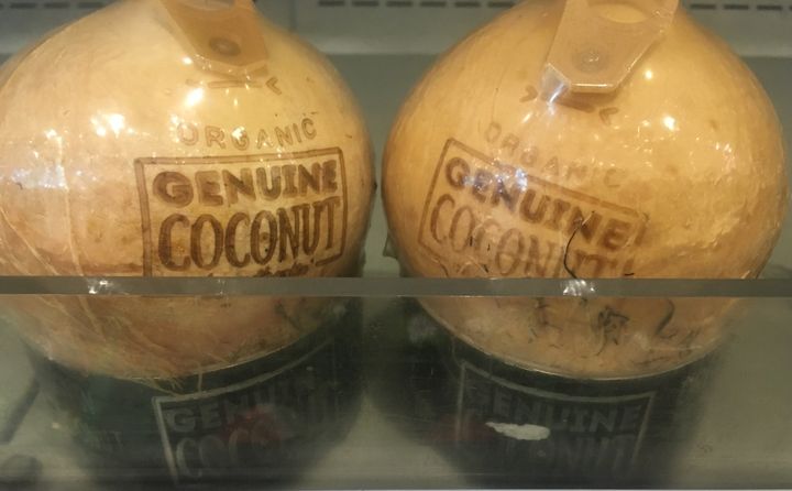 The new generation of shrink-wrapped coconuts have plastic stands and plastic tabs.