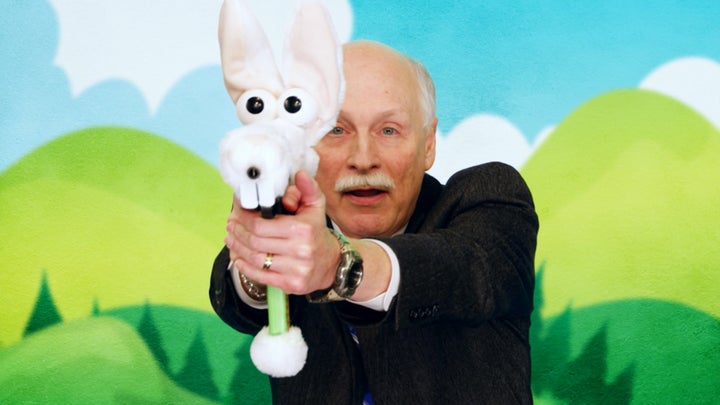 Gun rights advocate Philip Van Cleave participating in an fictional ad campaign for stuffed animal guns for children in the premiere of "Who Is America?"