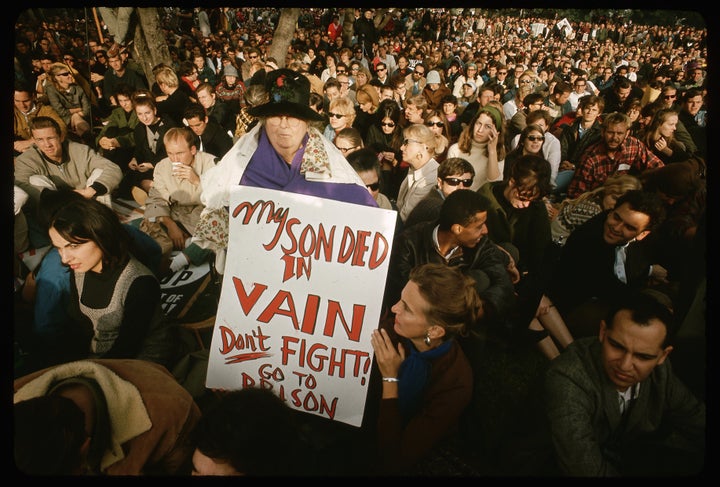 The mother of a man who died in Vietnam holds up a sign protesting U.S. involvement in the war during a demonstration in the 1970s.
