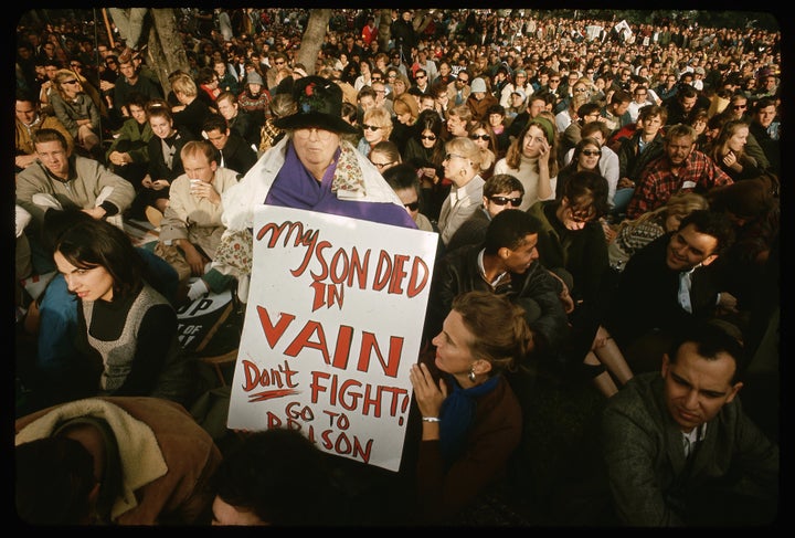 The mother of a man who died in Vietnam holds up a sign protesting U.S. involvement in the war during a demonstration in the 1970s. 