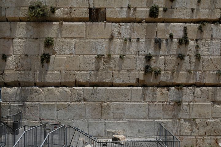 A stone that fell off the Western Wall in Jerusalem can be seen near the wall in Jerusalem's Old City on Monday.