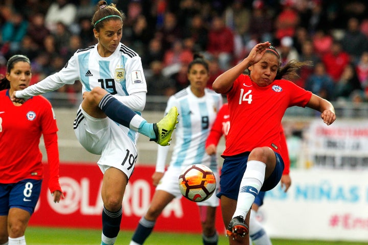 Argentina’s Mariana Larroquette (front left) and Chile’s Fernanda Pinilla (right) during a Women’s Copa America match in Serena, Chile on April 22. Chile has qualified for the 2019 Women World Cup in France.