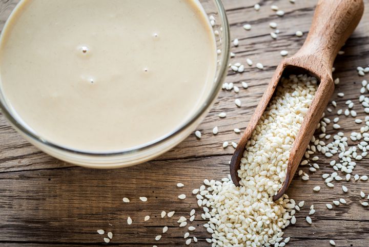 Tahini can be compared to peanut butter in flavor and texture, if you've never had it.
