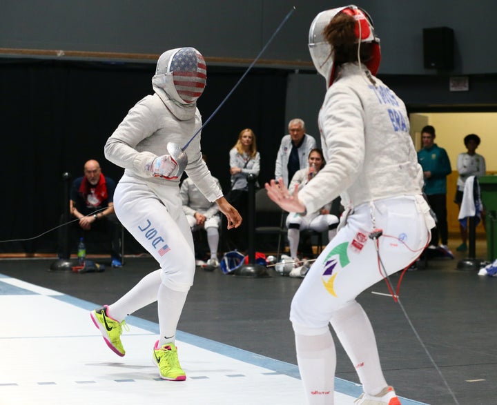 Ibtihaj Muhammad (left) fences Karina Trois of Brazil during the Pan-American Fencing Championships in Montreal on June 17, 2