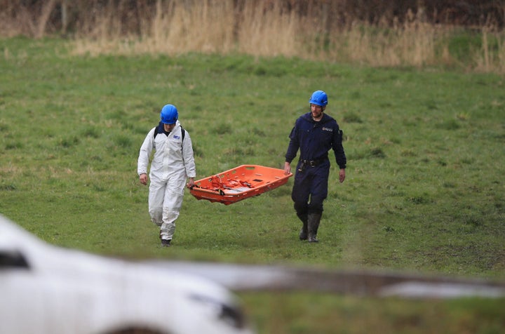 Police at the scene in a field near George Street in Heywood, Greater Manchester, after the body of a newborn baby was found in April.