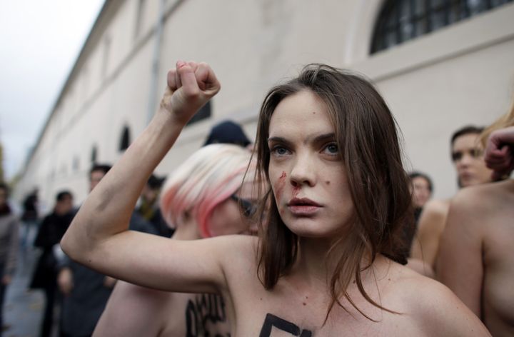 Oksana Shachko raises her fist during a protest against the Roman Catholic Church on Nov. 18, 2012, in Paris, France.