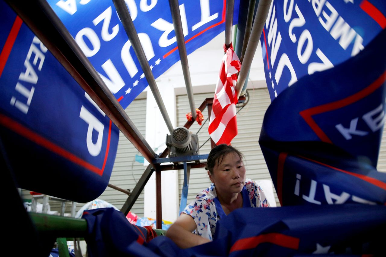 A worker makes flags for U.S. President Donald Trump's "Keep America Great!" 2020 re-election campaign. 