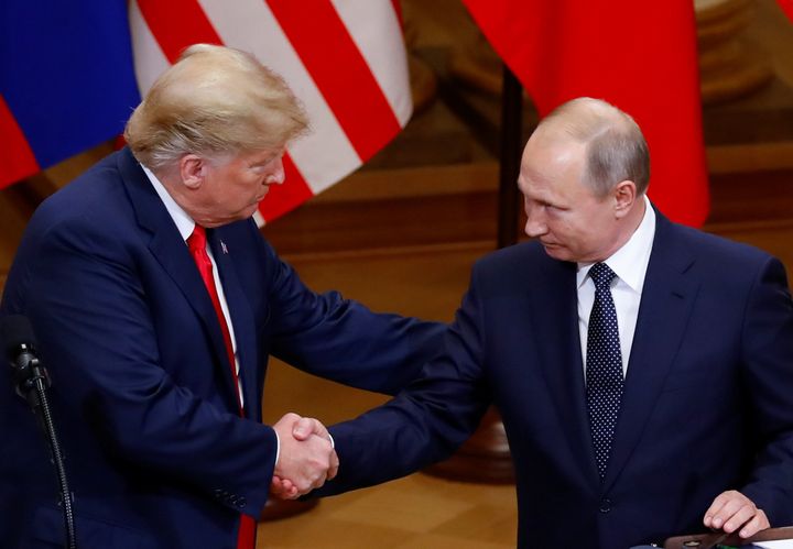 U.S. President Donald Trump and Russian President Vladimir Putin shake hands during a joint news conference in Helsinki on July 16.