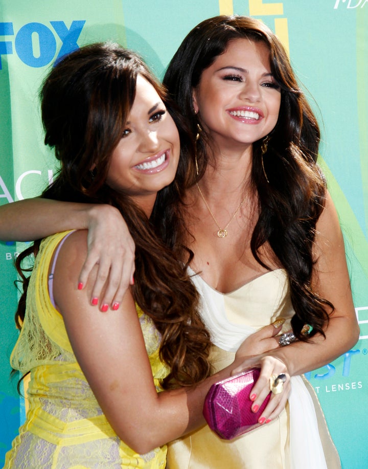 Demi Lovato and Selena Gomez pose together at the 2011 Teen Choice Awards.