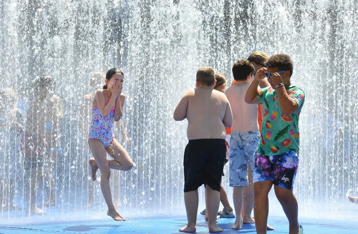 Children play in the fountain on the South Bank in London.