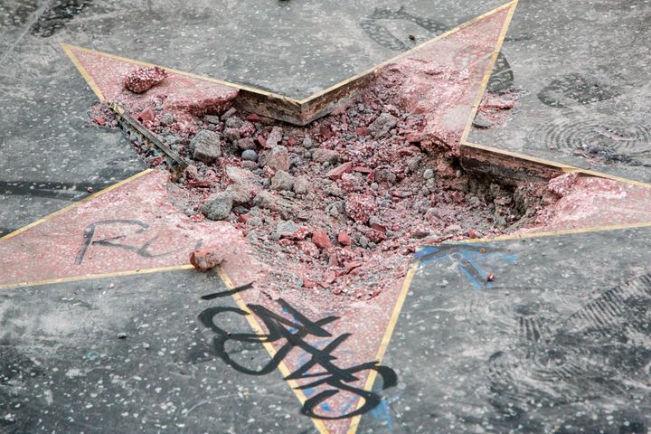 The remains of President Donald Trump's Hollywood Walk of Fame star are seen after it was vandalized early Wednesday morning by a man with a pickax.