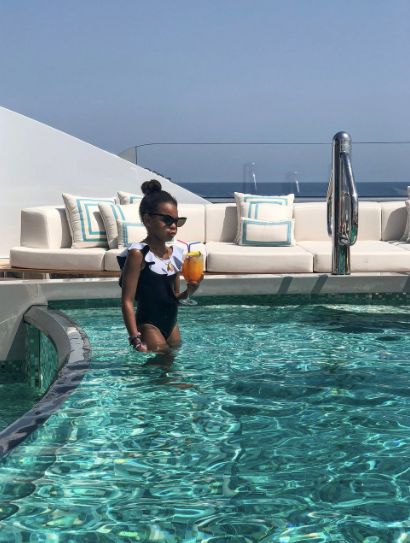 Blue Ivy pictured in a pool on the yacht. 