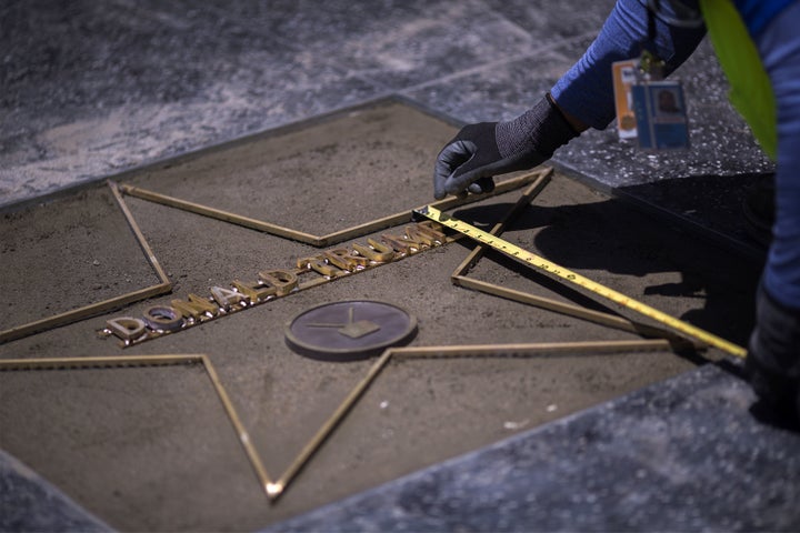 Workers were already hard at work to replace Trump's star after it was destroyed by a vandal on Wednesday.