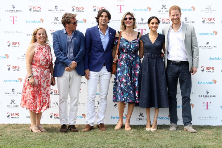 Sentebale CEO Cathy Ferrier, Sentebale Chairman Johnny Hornby, Sentebale Ambassador Nacho Figuares, wife Delfina Figueras, Meghan Duchess of Sussex and Prince Harry, Duke of Sussex pose together.