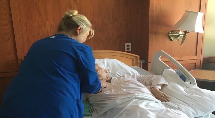 Hospice nurse Dee Metzger administers a painkiller and sedative to cancer patient Nancy Mattes, 68, at the David Simpson Hospice House, one of three inpatient hospices in the Cleveland area run by the Hospice of the Western Reserve. Mattes, a former sixth-grade teacher, died the next day.