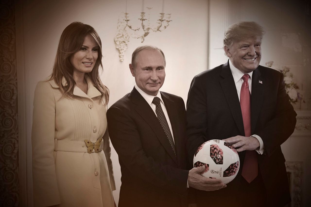 Russian President Vladimir Putin gives President Donald Trump a soccer ball from the World Cup as first lady Melania Trump joins them for photos on July 16 in Helsinki.