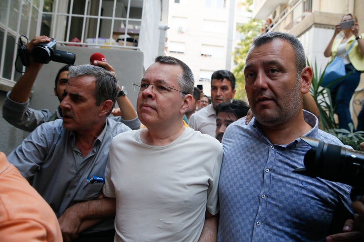 American Pastor Andrew Craig Brunson (center) was placed under house arrest due to unspecified health problems, in Izmir, Turkey, on July 25, 2018.