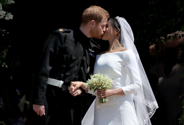 Prine Harry and Meghan, Duchess of Sussex, kiss outside St. George's Chapel in Windsors Castle, just after their wedding. 