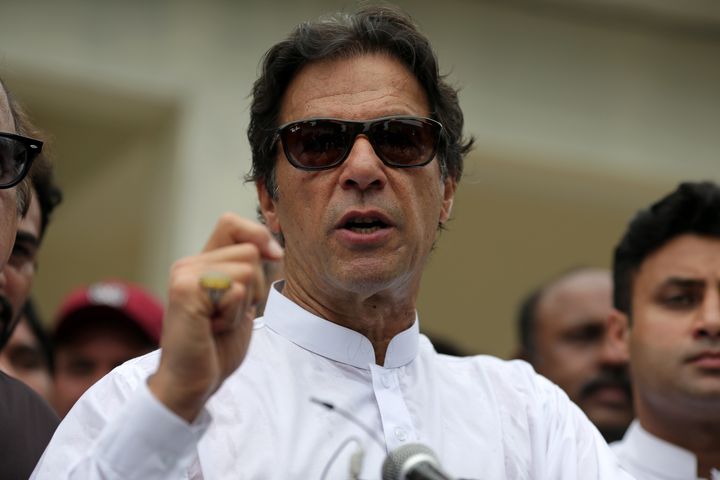 Cricket star-turned-politician Imran Khan, chairman of Pakistan Tehreek-e-Insaf (PTI), speaks to members of media after casti