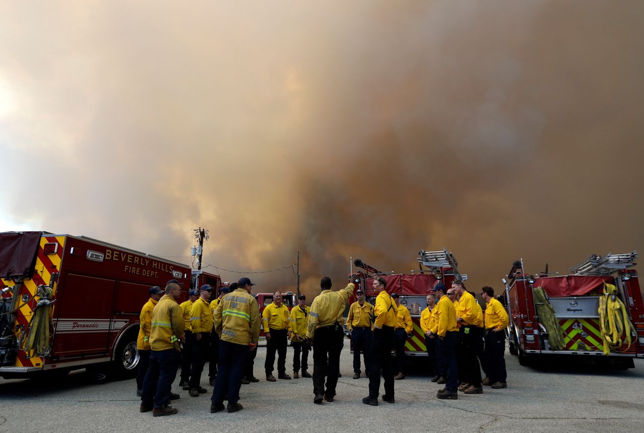 California sweltered under a heat wave as firefighters battled ferocious fires at both ends of the state.