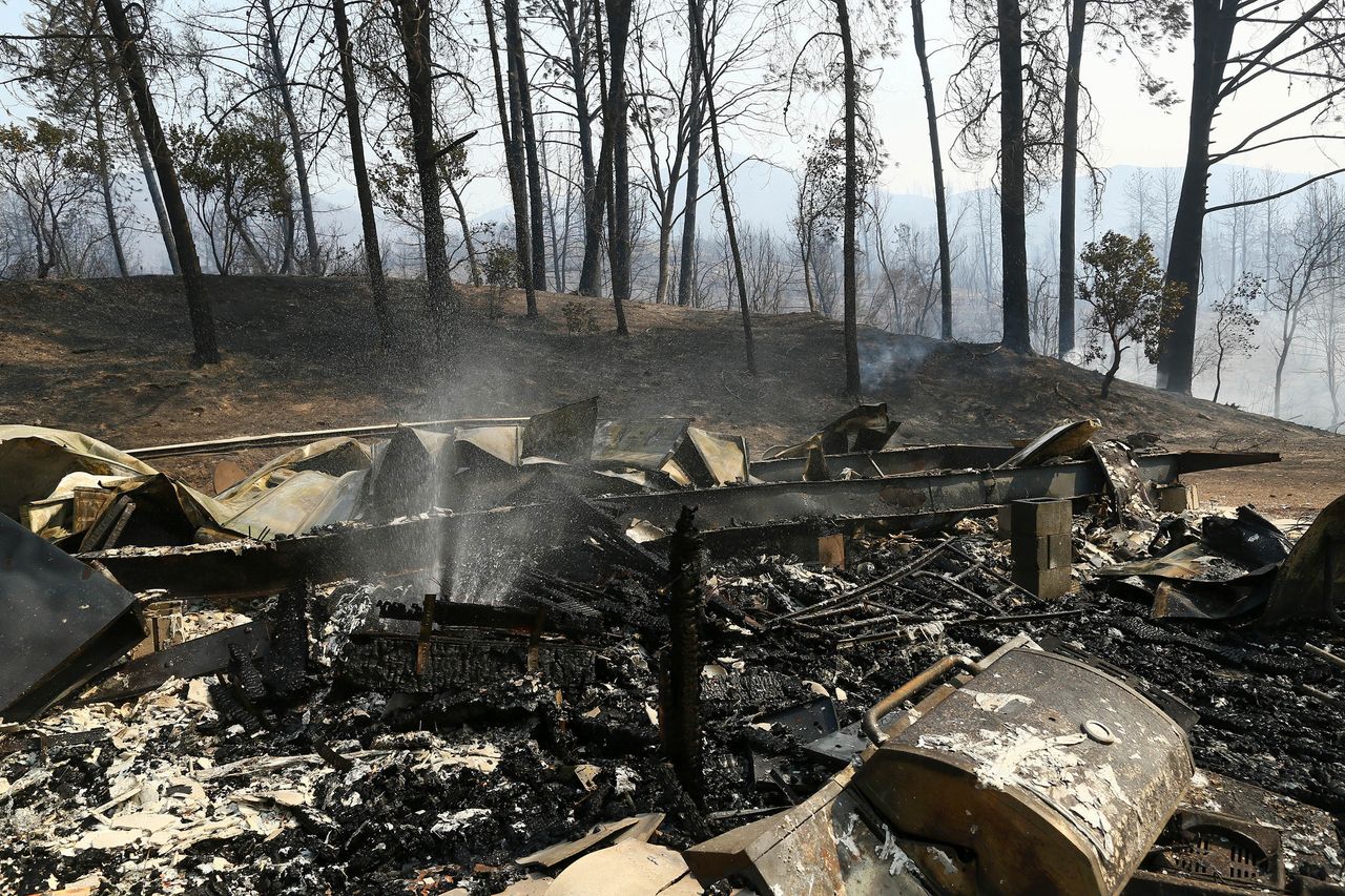 The remains of a home burned by a wildfire in Whiskeytown, Calif.