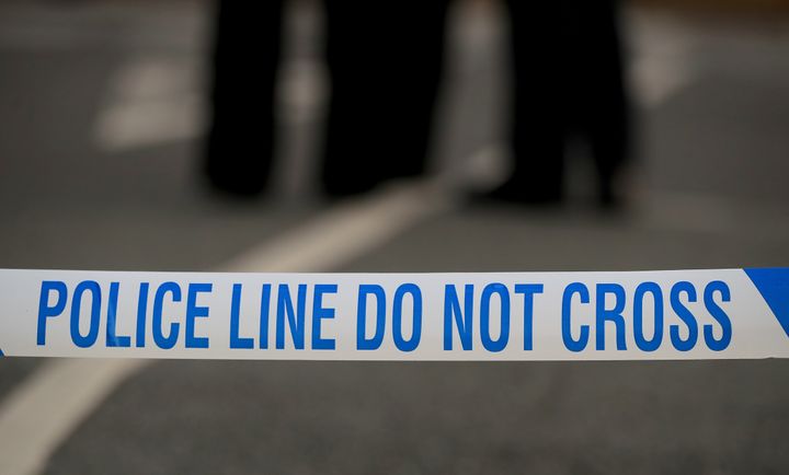 Two men have been arrested after a woman was discovered dead at her home in Bolton. 