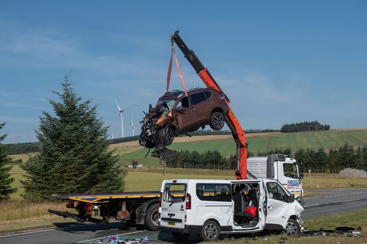 A car is removed from the A96 as police continue to investigate.