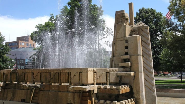 The Fountain of the Pioneers, shown here in 2016, featured a sculpture, at right, that depicted a white settler holding a weapon and overshadowing a Native American. The sculpture was put into storage earlier this year.