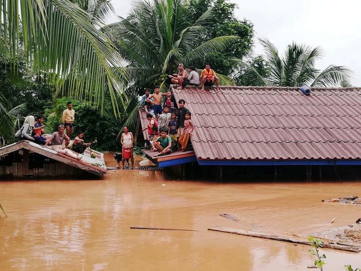 Villagers fled to the roofs of their homes after the Xepian-Xe Nam Noy hydropower dam collapsed in Attapeu province, Laos