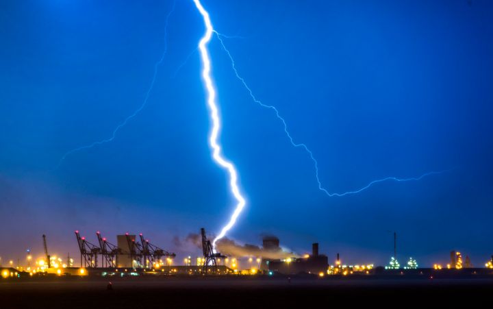 Lightning flashes over Humber estuary near Hull as clouds obscure a view of the 'Blood moon', the longest lunar eclipse of the century which sees Earth's natural satellite turn blood red.