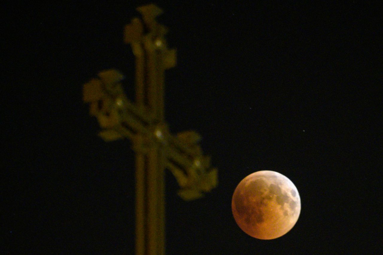 The moon passes over an Armenian Apostolic Church cathedral in Yerevan.