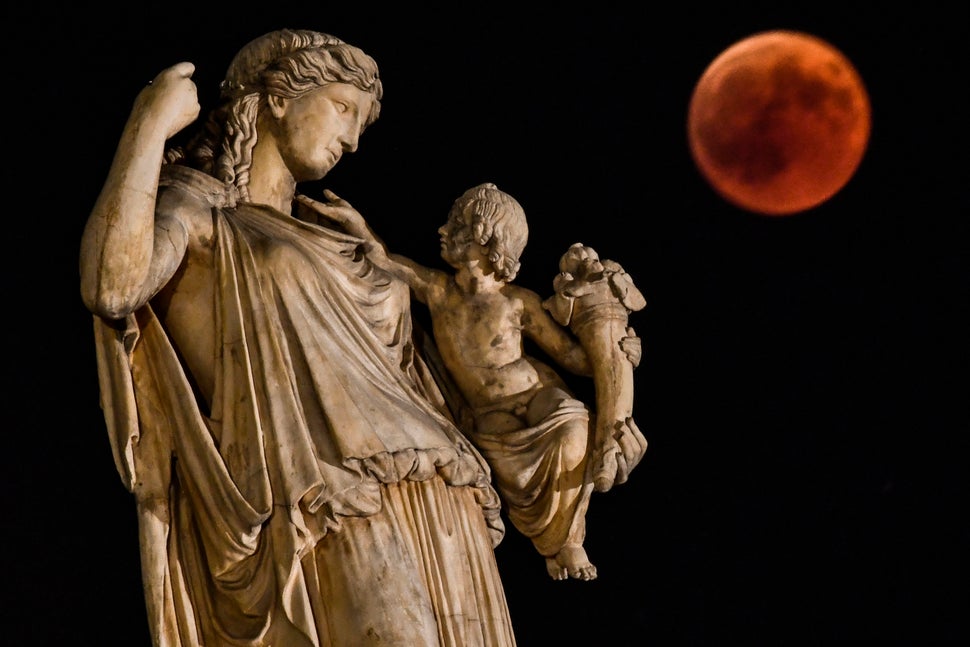 Next to the statue of the ancient Greek goddess Irine in Athens, Greece.