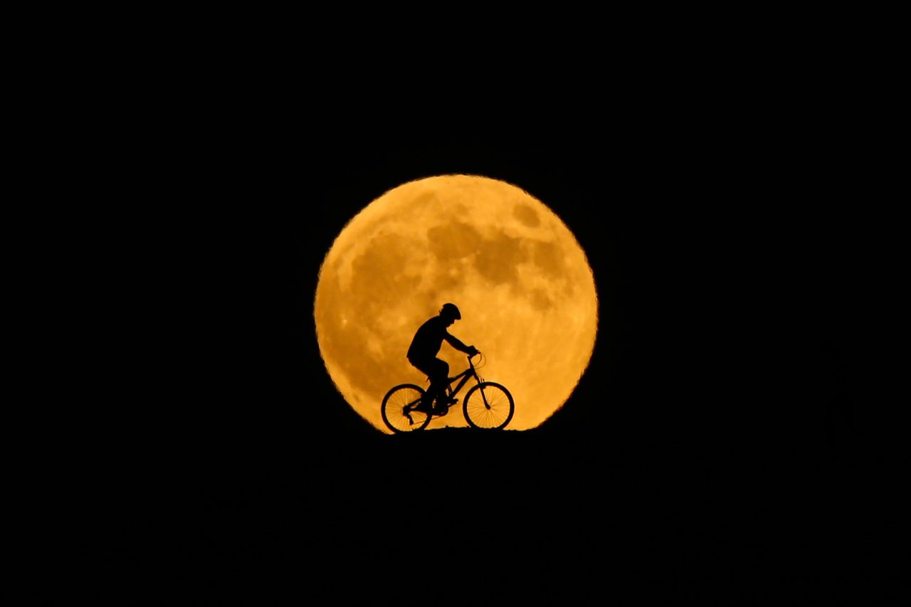 Behind the silhouette of a man riding a bicycle in Van, Turkey.