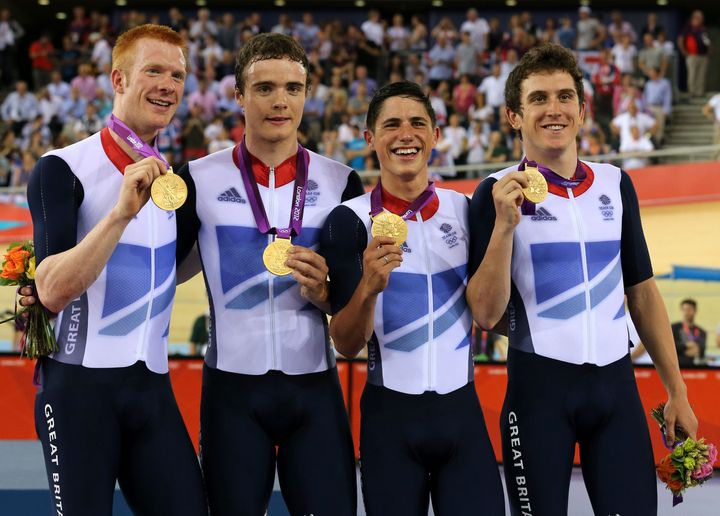 Thomas with Great Britain's Ed Clancy, Steven Burke and Peter Kennaugh celebrating with their gold medals in the men's team pursuit at the 2012 Olympic Games.