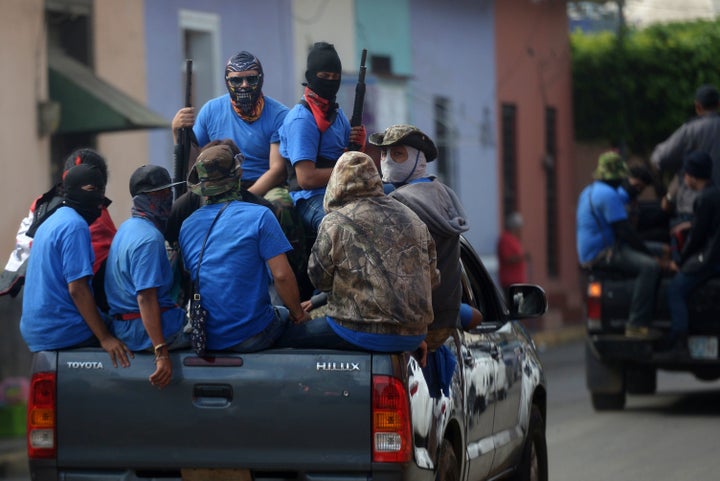 Members of a paramilitary group are seen in Masaya, Nicaragua, on July 18 following clashes with anti-government demonstrators.