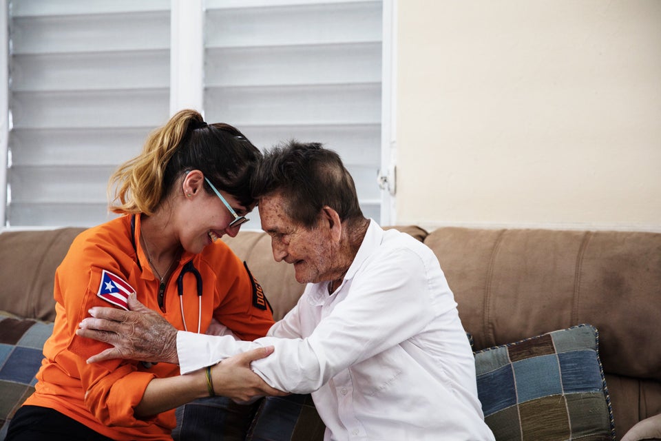 Gil Feliciano says goodbye to one of the doctors from Iniciativas De Paz that came to check on him and his wife.