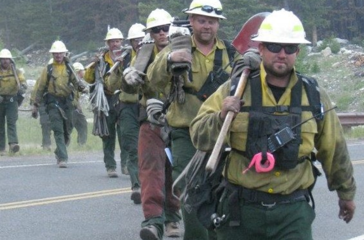 Jason Campbell and his crew of firefighters after a shift fighting the Index Creek Fire in Wyoming's Shoshone Na