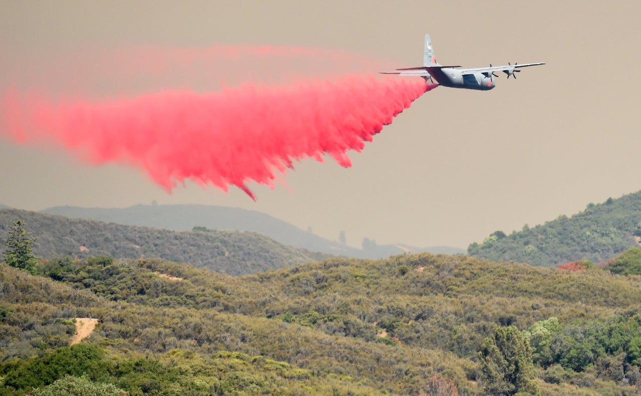 The fire slowed on Monday as winds subsided, and firefighting crews were able to get into neighborhoods to prevent embers from taking out additional homes.