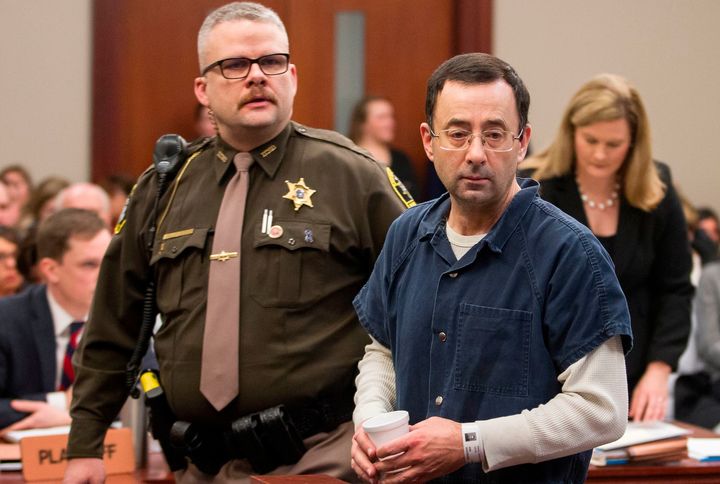 Nassar is led to the witness box during a sentence hearing in Lansing, Michigan, on Jan. 16, 2018. 