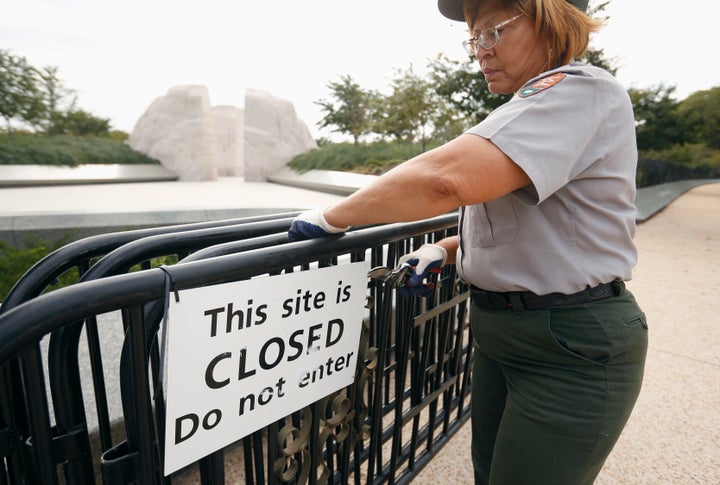 A National Park Service worker removes barriers around the Martin Luther King Jr. Memorial in Washington after it w