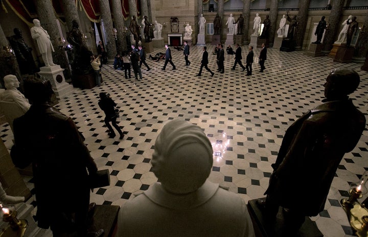 Then–Speaker of the House John Boehner (center) at the Capitol before a vote to end a government shutdown and rais
