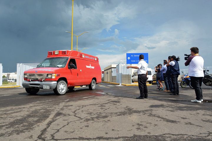 An ambulance is seen at the airport of Durango, in northern Mexico, after a plane carrying 97 passengers and four crew crashed on take off.