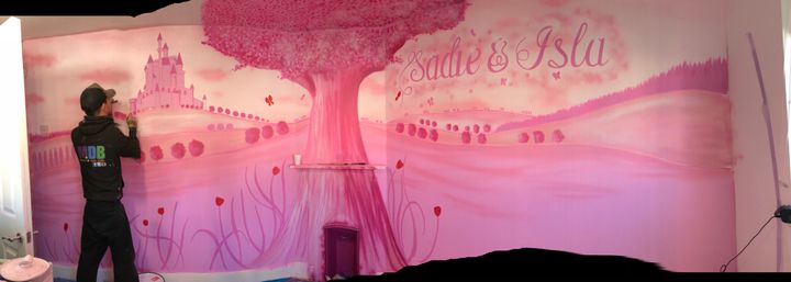 Isla and Sadie's new bedroom room with a beautiful wall mural.