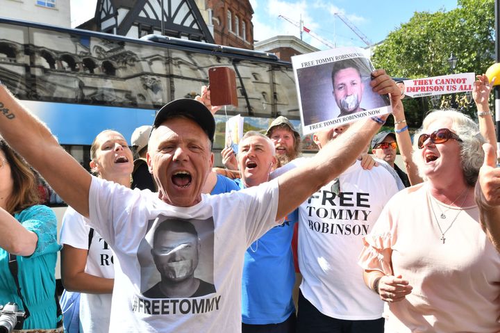 Supporters of Tommy Robinson celebrate outside the Royal Court of Justice
