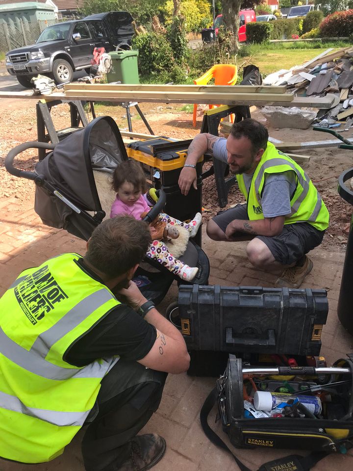 Pippa and some of the tradesmen helping her family. 